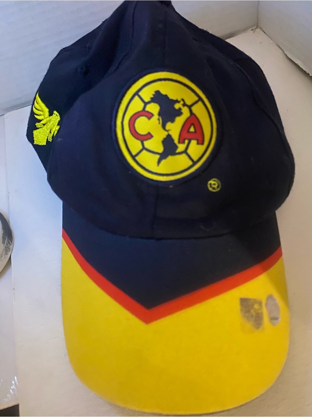 Source Unknown Navy, Yellow and Red Baseball Cap with Embroidered Crest